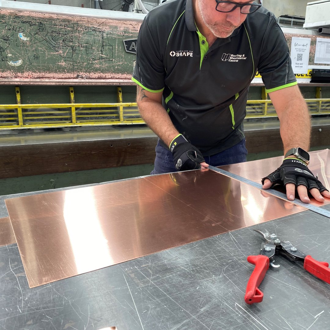 Staff Member Making a Copper Rainhead
